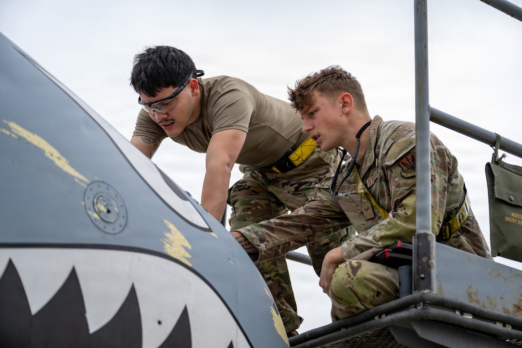 Maintainers working on an A10C Thunderbolt II.
