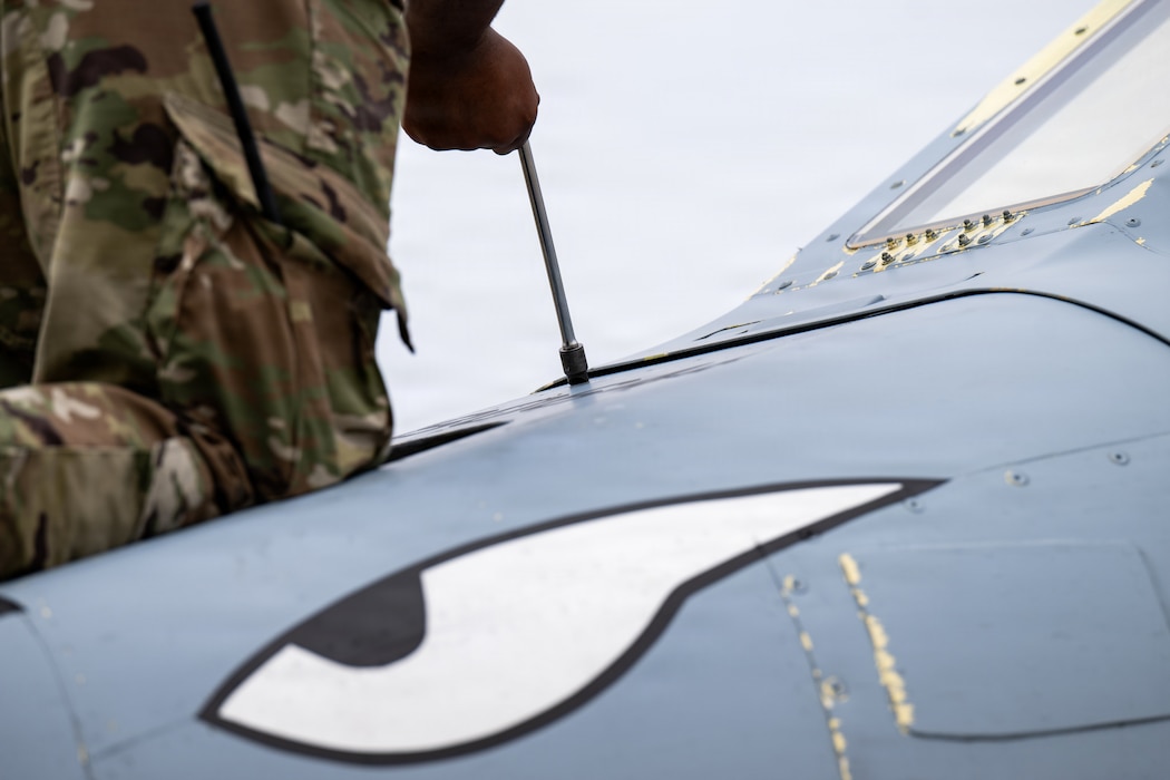 Military members working on an A-10C Thunderbolt II.