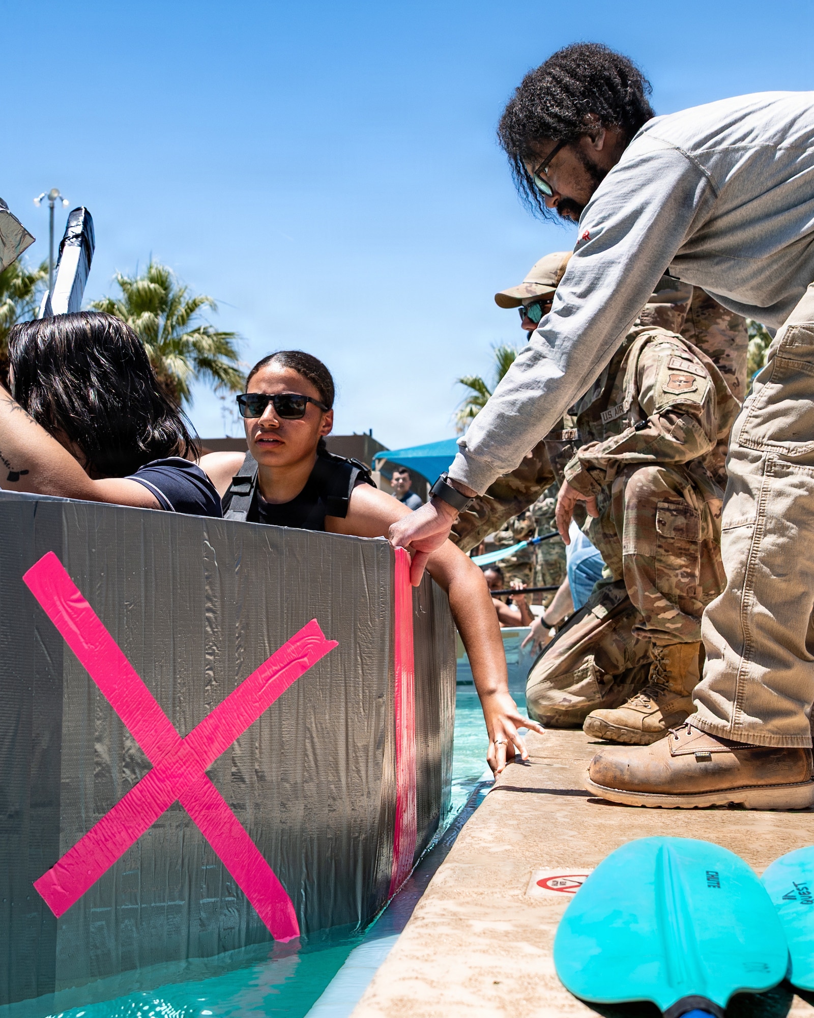 U.S. Air Force Airmen assigned to the 56th Fighter Wing prepare boats to begin racing in the annual 56th Civil Engineer Squadron Boat Regatta at Luke Air Force Base, Arizona, May 20, 2026.
