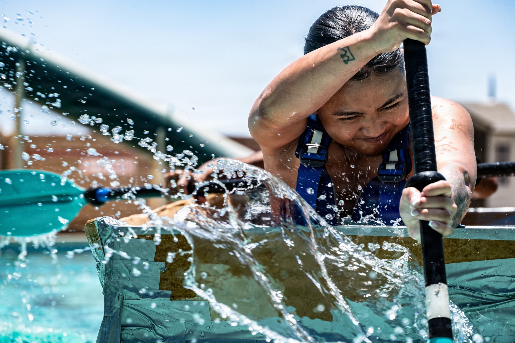 U.S. Air Force Senior Airman Mary Ramos, 56th Civil Engineer Squadron operations management journeyman, paddles toward the finish line during the annual 56th CES Boat Regatta at Luke Air Force Base, Arizona, May 20, 2026.