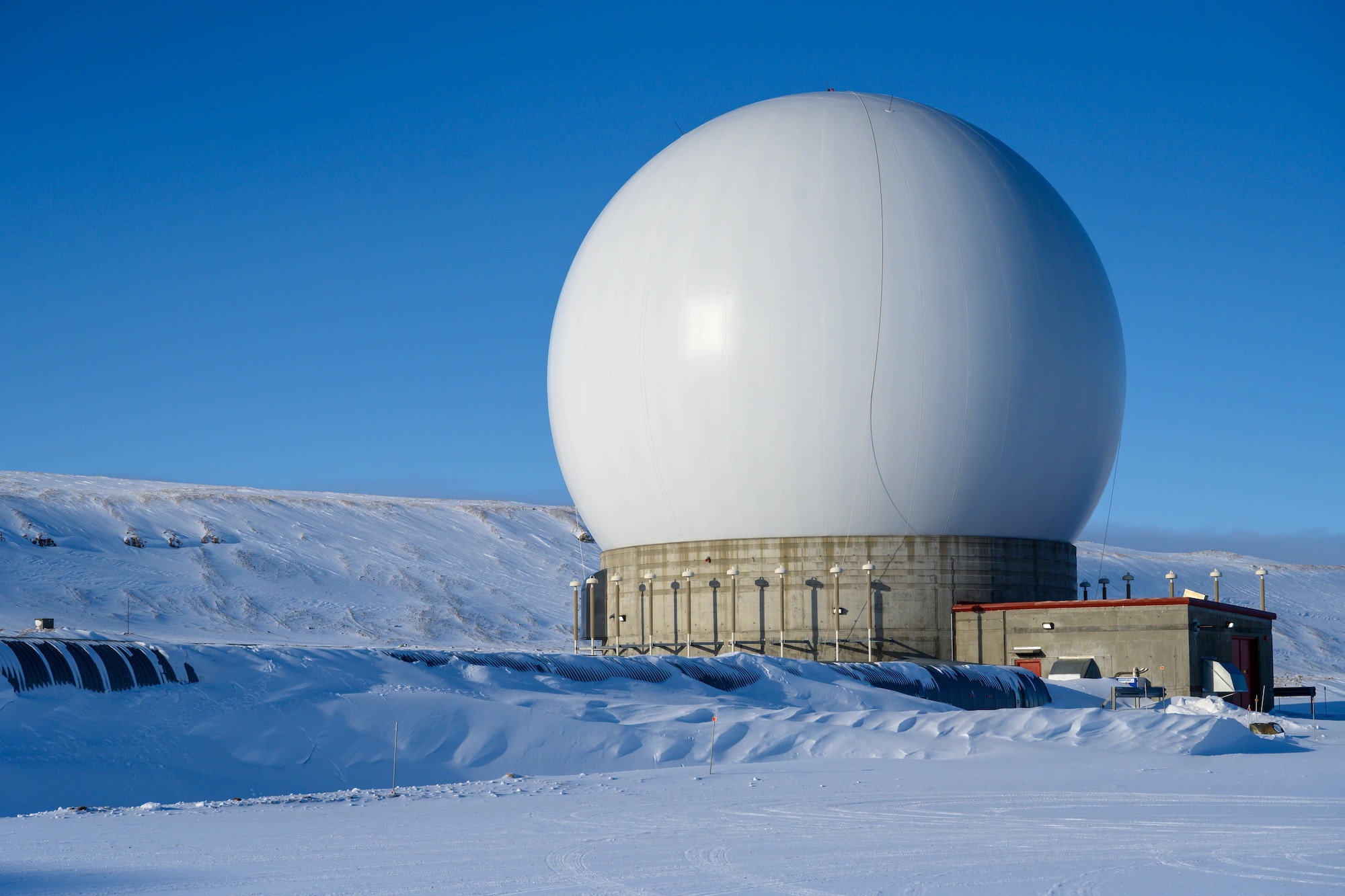 Thule Tracking Station, known as callsign POGO, operated by the 22nd Space Operations Squadron, Detachment 7, is the northernmost unit of seven worldwide tracking stations in the U.S. Space Force Satellite Control Network at Pituffik Space Base, Greenland, April. 8, 2026. A component of Mission Delta 31 - Det 7’s mission is to provide telemetry, tracking and commanding operations to the U.S. and allied government satellite programs. The detachment’s extreme northern location allows contact with polar orbiting satellites 5-12 times per day ranging in altitude from 120 miles to 24,800 miles above the earth's surface. (U.S. Space Force photo by Heather Johnson)