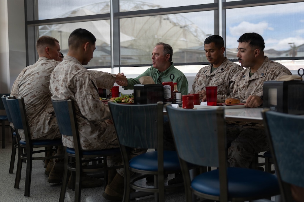 U.S. Sen. Adam Schiff eats lunch with U.S. Marines at the Dunham Mess Hall, Marine Corps Air Ground Combat Center, Twentynine Palms, California, May 5, 2026.  The visit included a command brief on installation and training operations, an aerial tour of the training areas, and a roundtable lunch with Marines to discuss their service. (U.S. Marine Corps photo by Lance Cpl. Lainey Brummett)