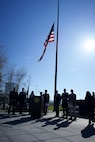 A U.S. flag flies over a speaking stand.