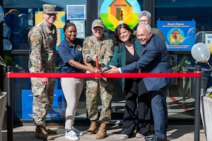 U.S. Air Force Col. Kathleen Hasson, center, 305th Air Mobility Wing commander, Staff Sgt. Paradise Henson, center left, 305th AMW program manager and noncommissioned officer in charge of Sean’s Room, Col. Michael Stefanovic, far left, Joint Base McGuire-Dix-Lakehurst and 87th Air Base Wing commander, and local community leaders officially open Sean’s Room at JB MDL, N.J., May 1, 2026.