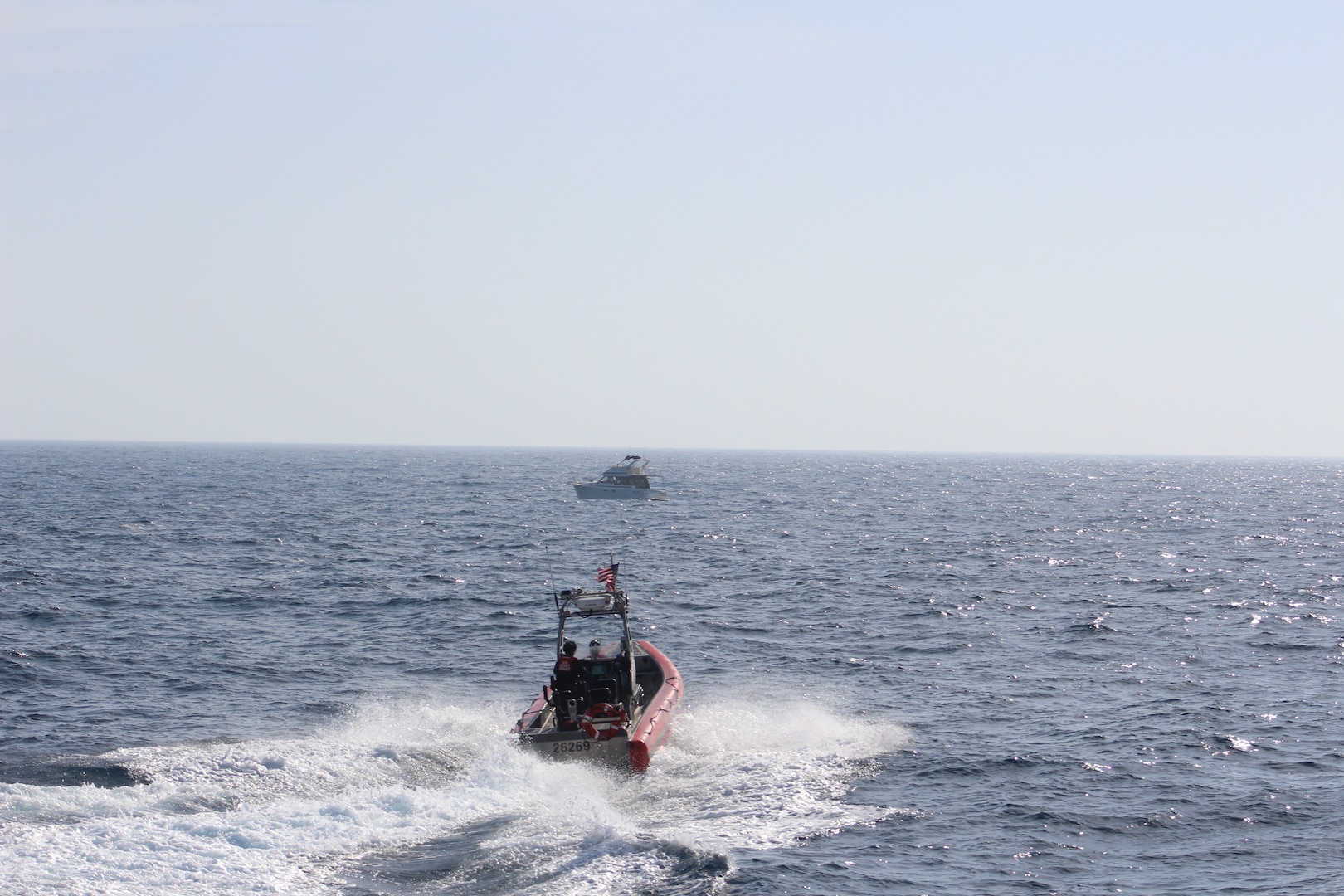 A Coast Guard boarding team assigned to the 154-foot fast response cutter USCGC John McCormick (WPC 1121) conducts a vessel boarding approximately 22 miles offshore of Mission Bay in San Diego, California, May 19, 2026. During the boarding, 36 suspected aliens were identified, all claiming Mexican nationality. (U.S. Coast Guard courtesy photo)