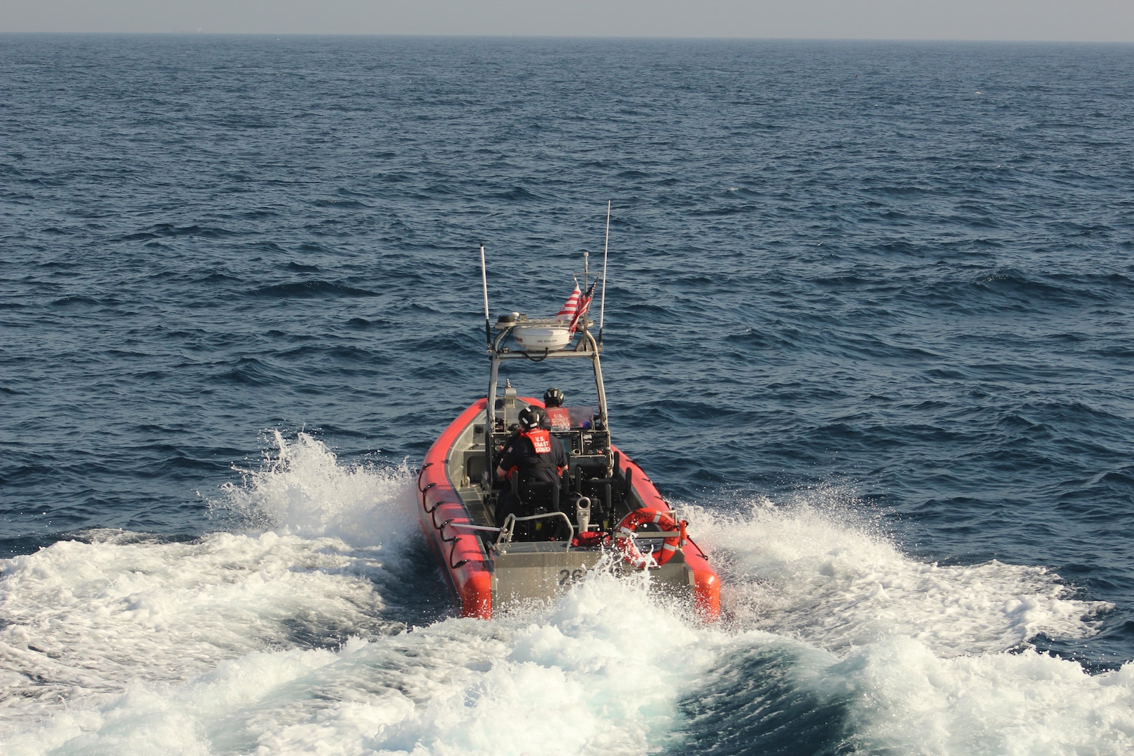 A Coast Guard boarding team assigned to the 154-foot fast response cutter USCGC John McCormick (WPC 1121) conducts a vessel boarding approximately 22 miles offshore of Mission Bay in San Diego, California, May 19, 2026. During the boarding, 36 suspected aliens were identified, all claiming Mexican nationality. (U.S. Coast Guard courtesy photo)