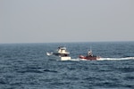 A Coast Guard boarding team assigned to the 154-foot fast response cutter USCGC John McCormick (WPC 1121) conducts a vessel boarding approximately 22 miles offshore of Mission Bay in San Diego, California, May 19, 2026. During the boarding, 36 suspected aliens were identified, all claiming Mexican nationality. (U.S. Coast Guard courtesy photo)