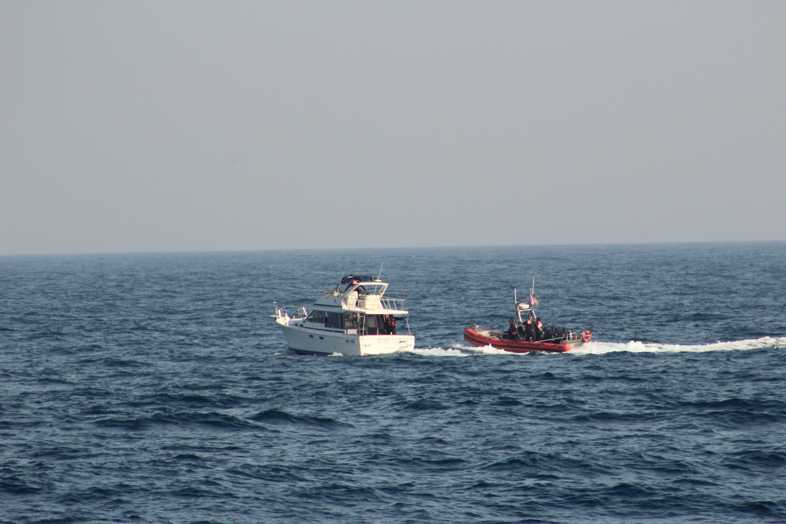 A Coast Guard boarding team assigned to the 154-foot fast response cutter USCGC John McCormick (WPC 1121) conducts a vessel boarding approximately 22 miles offshore of Mission Bay in San Diego, California, May 19, 2026. During the boarding, 36 suspected aliens were identified, all claiming Mexican nationality. (U.S. Coast Guard courtesy photo)
