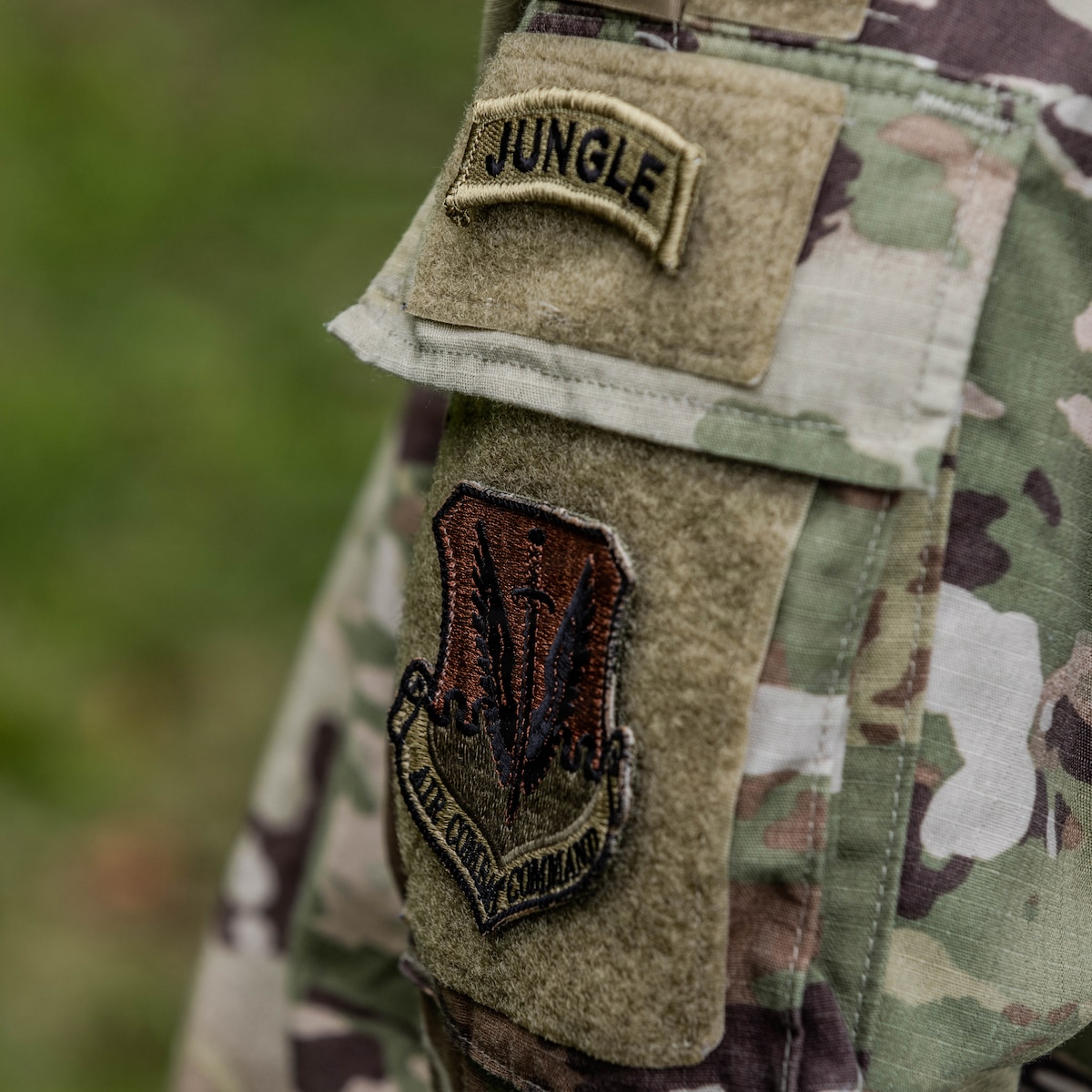 U.S. Air Force Staff Sgt. Duchaine Paul, assigned to the 824th Base Defense Squadron, is awarded the jungle tab on graduation day of the Jungle Operations Training Course - Panama at Aeronaval Base Cristóbal Colón, Panama, May 15, 2026. The 18-day course pushed participants to refine the skills needed to operate effectively in jungle environments while strengthening multinational interoperability. (U.S. Army photo by Spc. Richard Morgan)