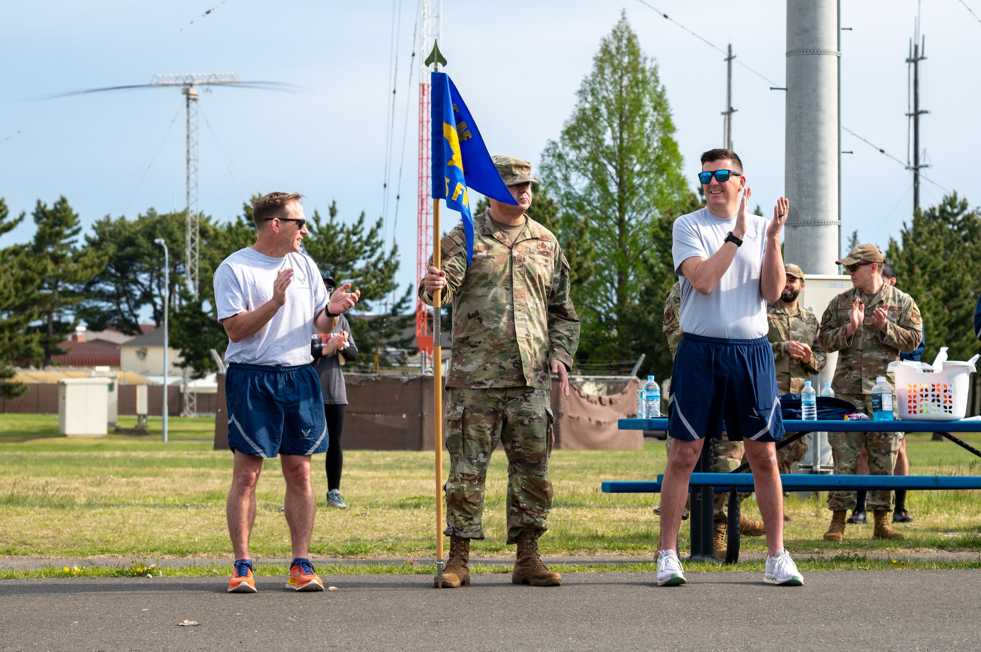 From left, U.S. Air Force Col. Paul Davidson, 35th Fighter Wing (FW) commander, Chief Master Sgt. David Najera, 35th Fighter Wing command chief, and Col. Matthew Hoyt, 35th Fighter Wing deputy commander, prepare for warmups before the Wing Run at Misawa Air Base, Japan, May 11, 2026.