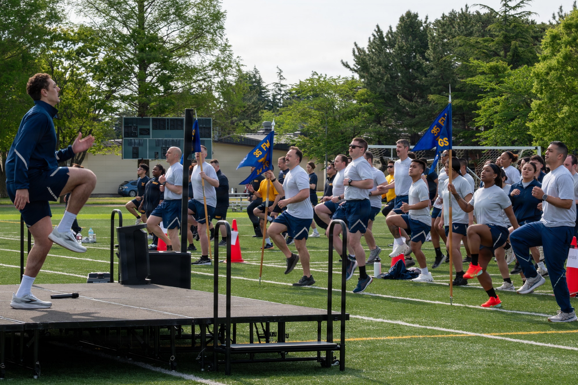 U.S. Airmen assigned to the 35th Fighter Wing and Sailors assigned to the Naval Air Facility Misawa, participate in warmups for a Wing Run at Misawa Air Base, Japan, May 11, 2026.