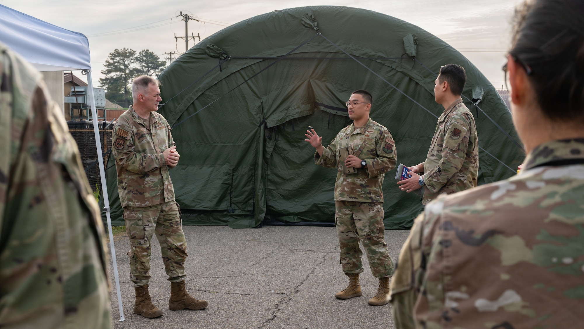 A person briefs a group of people.