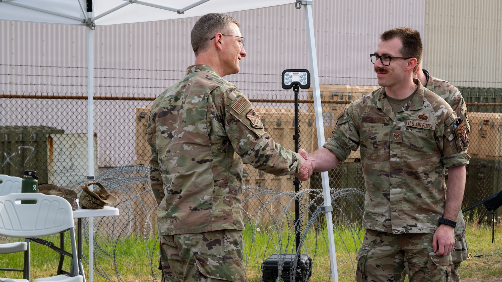 Two people shaking hands.