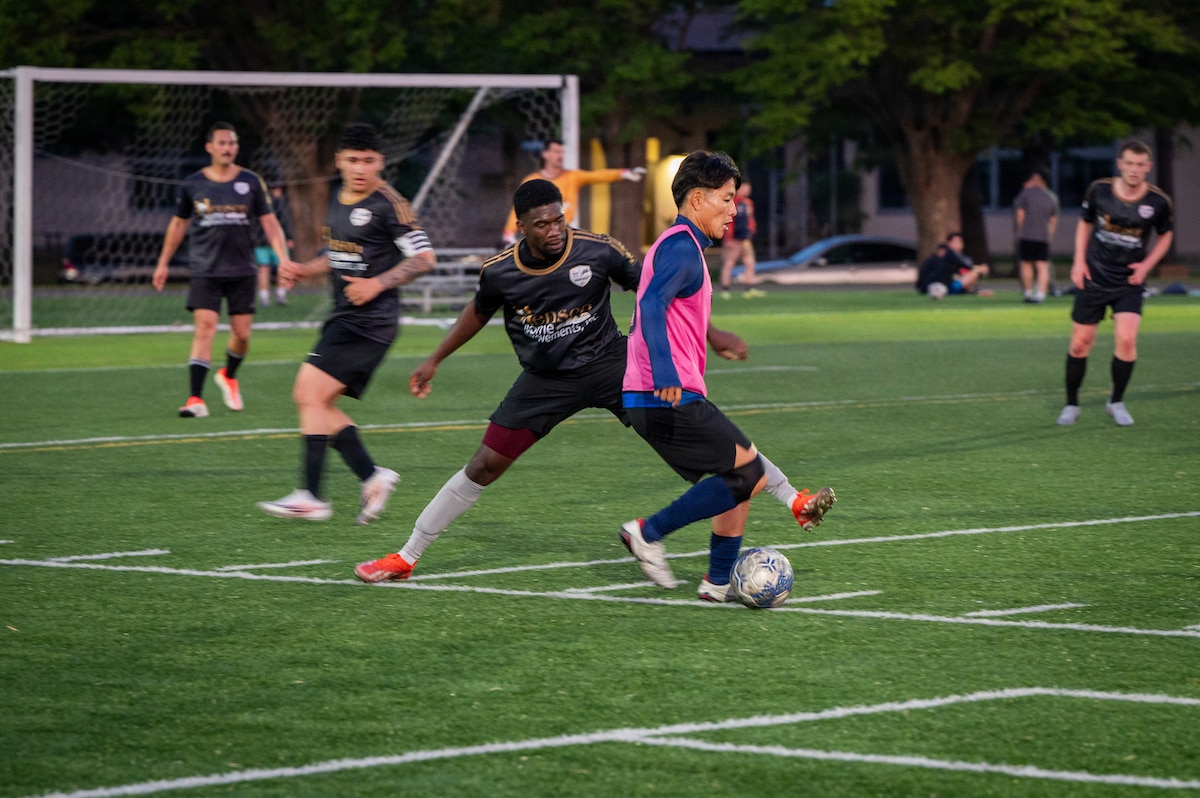 U.S. military and Japan Air Self-Defense Force teams compete in a soccer match during the 2026 Sakura Olympics at Misawa Air Base, Japan, May 12, 2026. The annual event celebrates athleticism, unity and international friendship while bringing together members of the Misawa community through sports competition. (U.S. Air Force photo by Airman 1st Class Angelica Winther)