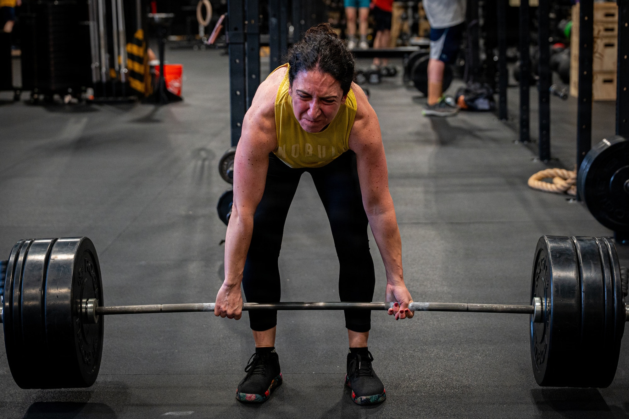 Michela Kuhn, a military spouse, pushes through a deadlift during the 2026 Sakura Olympics at Misawa Air Base, Japan, May 12, 2026. The event highlights teamwork, determination and friendly competition while strengthening connections across the Misawa bilateral military community. (U.S. Air Force photo by Airman 1st Class Angelica Winther)