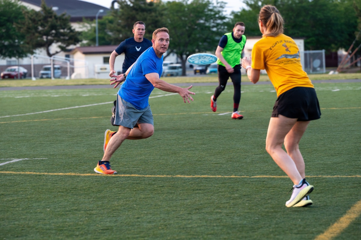 U.S. Air Force Col. Paul Davidson, 35th Fighter Wing commander, passes a frisbee during an ultimate frisbee match as part of the 2026 Sakura Olympics at Misawa Air Base, Japan, May 13, 2026. The event highlights teamwork, communication and friendly competition while bringing members of the Misawa community together through recreational sports. (U.S. Air Force photo by Airman 1st Class Angelica Winther)