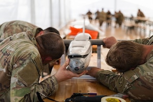 U.S. Army Staff Sgt. Nicholas Davis, Staff Sgt. Terrence Giles and Spc. Octavio Landeros, all with the Field Artillery Squadron, 2d Cavalry Regiment, check the center of gravity of a one-way attack Hornet drone after assembly in preparation for flight operations at Bemowo Piskie Training Area, Poland, May 3, 2026. From April 27 to May 31, 2026, U.S. and Allied forces will exercise NATO’s Eastern Flank Deterrence Initiative, demonstrating NATO’s ability to fight and win on the modern battlefield. Nearly 15,000 troops from eleven nations will train across the High North, Baltic region, and Poland, executing rapid maneuvers, air defense, counter-drone operations, and cyber defense to validate NATO’s regional defense plans in real time. This series of linked exercises, including Saber Strike, Immediate Response, and Swift Response, turns investment into capability. Soldiers integrate unmanned systems, AI-enabled command and control, and live data networks to move faster, decide faster, and fight more effectively across all domains. Sword 26 demonstrates how U.S. Army Europe and Africa drives transformation at scale while strengthening deterrence. Together with our Allies, we are building a unified, lethal force ready to defend NATO territory and respond to any threat. (U.S. Army Reserve photo by Capt. Katherine Bustos)