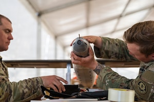 U.S. Army Staff Sgt. Nicholas Davis and Staff Sgt. Terrence Giles, with the Field Artillery Squadron, 2d Cavalry Regiment, assemble a one-way attack Hornet drone during training in preparation for flight operations at Bemowo Piskie Training Area, Poland, May 3, 2026. From April 27 to May 31, 2026, U.S. and Allied forces will exercise NATO’s Eastern Flank Deterrence Initiative, demonstrating NATO’s ability to fight and win on the modern battlefield. Nearly 15,000 troops from eleven nations will train across the High North, Baltic region, and Poland, executing rapid maneuvers, air defense, counter-drone operations, and cyber defense to validate NATO’s regional defense plans in real time. This series of linked exercises, including Saber Strike, Immediate Response, and Swift Response, turns investment into capability. Soldiers integrate unmanned systems, AI-enabled command and control, and live data networks to move faster, decide faster, and fight more effectively across all domains. Sword 26 demonstrates how U.S. Army Europe and Africa drives transformation at scale while strengthening deterrence. Together with our Allies, we are building a unified, lethal force ready to defend NATO territory and respond to any threat. (U.S. Army Reserve photo by Capt. Katherine Bustos)