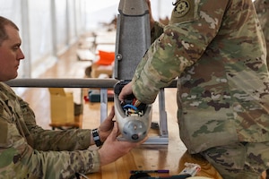 U.S. Army Staff Sgt. Nicholas Davis and Staff Sgt. Terrence Giles, with the Field Artillery Squadron, 2d Cavalry Regiment, assemble a one-way attack Hornet drone during training in preparation for flight operations at Bemowo Piskie Training Area, Poland, May 3, 2026. From April 27 to May 31, 2026, U.S. and Allied forces will exercise NATO’s Eastern Flank Deterrence Initiative, demonstrating NATO’s ability to fight and win on the modern battlefield. Nearly 15,000 troops from eleven nations will train across the High North, Baltic region, and Poland, executing rapid maneuvers, air defense, counter-drone operations, and cyber defense to validate NATO’s regional defense plans in real time. This series of linked exercises, including Saber Strike, Immediate Response, and Swift Response, turns investment into capability. Soldiers integrate unmanned systems, AI-enabled command and control, and live data networks to move faster, decide faster, and fight more effectively across all domains. Sword 26 demonstrates how U.S. Army Europe and Africa drives transformation at scale while strengthening deterrence. Together with our Allies, we are building a unified, lethal force ready to defend NATO territory and respond to any threat. (U.S. Army Reserve photo by Capt. Katherine Bustos)