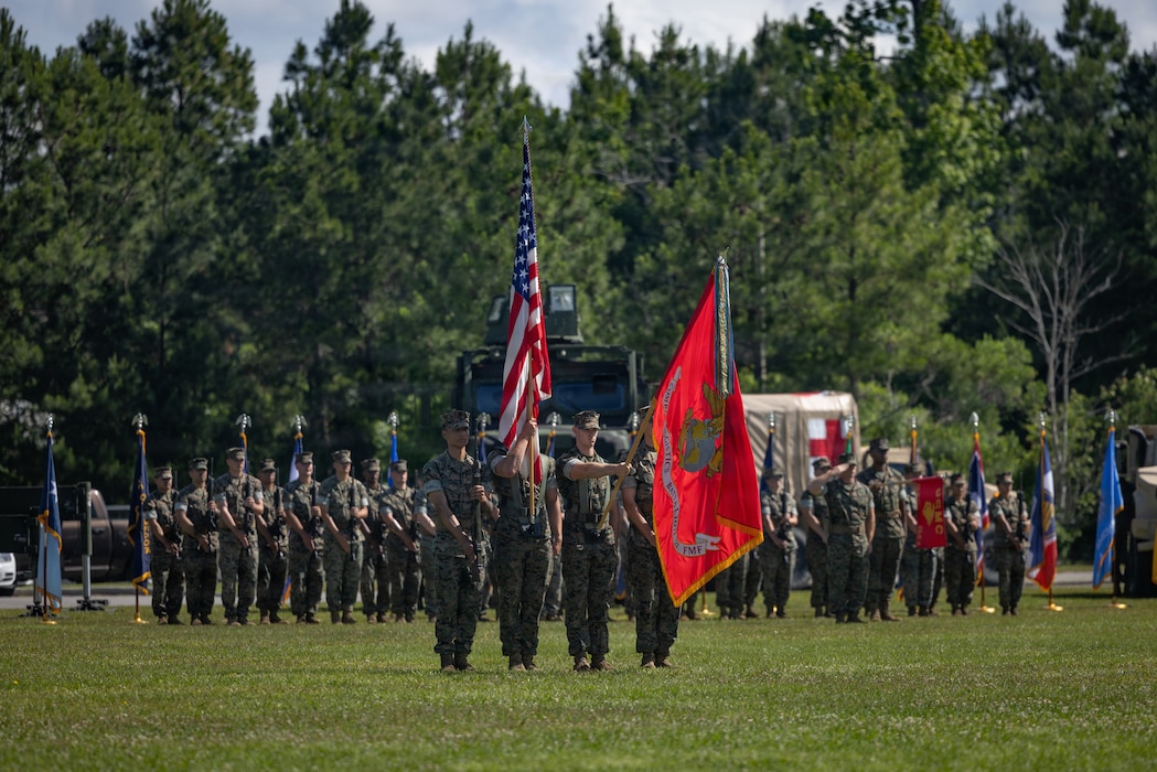 U.S. Marines with the color guard for Combat Logistics Battalion 22, Combat Logistics Regiment 27, 2nd Marine Logistics Group, present the battalion colors during a change of command ceremony at Marine Corps Base Camp Lejeune, North Carolina, May 21, 2026. The change of command ceremony is a time-honored tradition which formally signifies the transfer of command and entails total accountability, authority and responsibility from one individual to another. (U.S. Marine Corps photo by Sgt. Rafael Brambila-Pelayo)