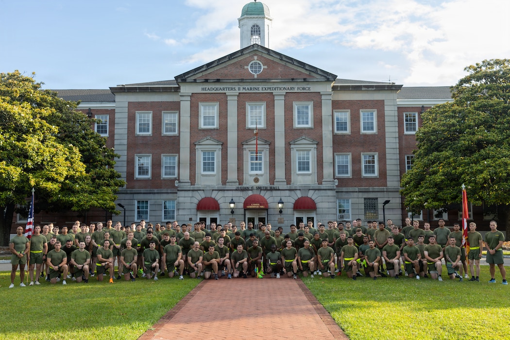U.S. Marines with II Marine Expeditionary Force Support Battalion pose for a photo in front of the previous II MEF headquarters building during a battalion run on Marine Corps Base Camp Lejeune, May 22, 2026. The battalion run was conducted to increase morale, camaraderie and to observe the Memorial Day holiday.