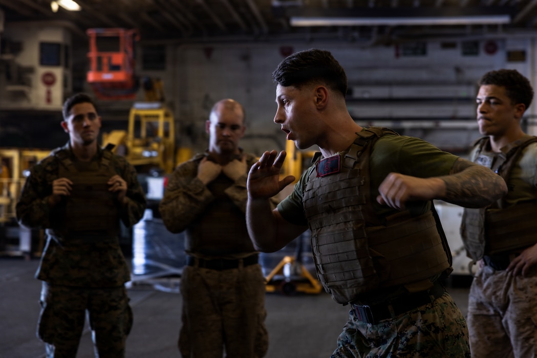 A U.S. Marine with 22nd Marine Expeditionary Unit (Special Operations Capable) demonstrates Marine Corps Martial Arts Program techniques aboard Wasp-class amphibious assault ship USS Iwo Jima (LHD 7), May 11, 2026. U.S. military forces are deployed to the Caribbean in support of the U.S. Southern Command mission, Department of War-directed operations, and the president’s priorities to disrupt illicit drug trafficking and protect the homeland. (U.S. Marine Corps photo)
