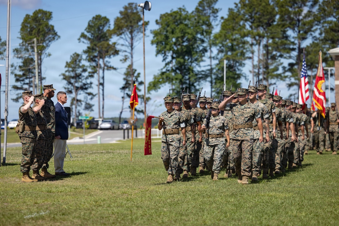 Current and former commanding officers of Combat Logistics Battalion 22, Combat Logistics Regiment 27, 2nd Marine Logistics Group, salute during a pass in review as part of a change of command ceremony at Marine Corps Base Camp Lejeune, North Carolina, May 21, 2026. The change of command ceremony is a time-honored tradition which formally signifies the transfer of command and entails total accountability, authority and responsibility from one individual to another. (U.S. Marine Corps photo by Sgt. Rafael Brambila-Pelayo)
