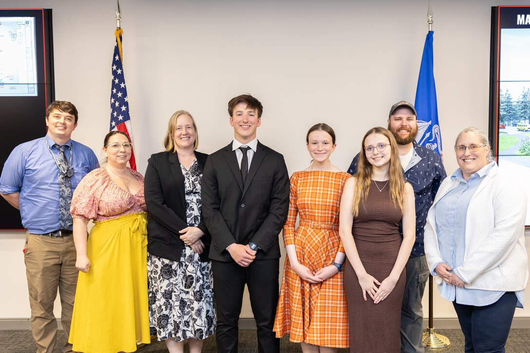 A group of students and mentors posing for a photo.