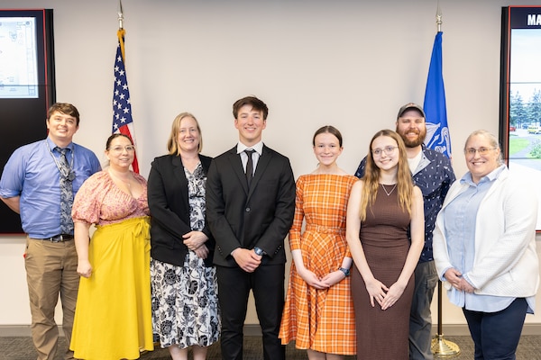 A group of students and mentors posing for a photo.
