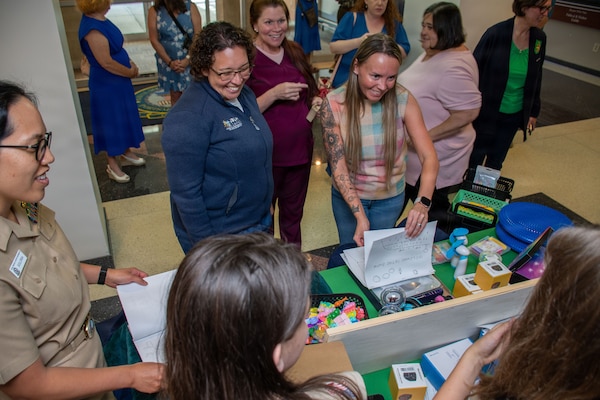 PORTSMOUTH, Va. (May 19, 2026) Girl Scout Troop 29 present Naval Medical Center Portsmouth Neurodevelopmental Pediatrics Division with a gift of sensory objects  to help improve patient outcomes at NMCP, May 21, 2026. Navy Medicine Readiness and Training Command (NMRTC) Portsmouth is the premier readiness and training platform that provides superior medical training for military medical service members at NMCP, the U.S. military’s oldest, continuously operating military hospital since 1830. (U.S. Navy photo by Mass Communication Specialist 2nd Class Thomas Boatright)