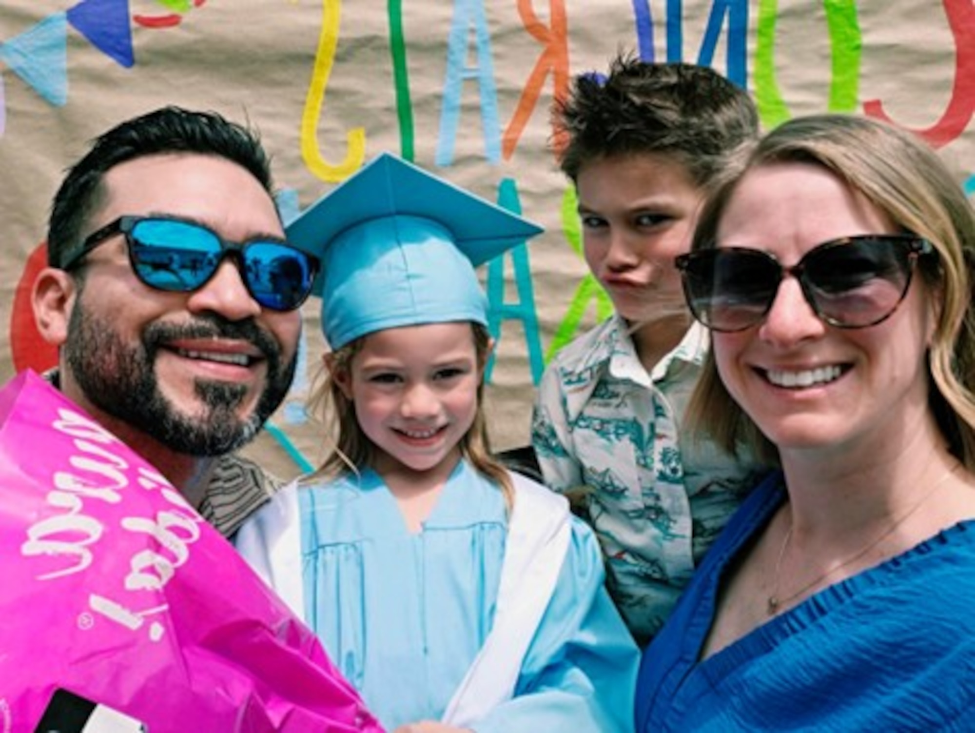 From left, Joseph Carrillo, Air Force Test Center contract specialist, Dahlia Carrillo, daughter of Carrillo, Benicio Carrillo, son of Carrillo, and Master Sgt. Stephanie Carrillo, wife of Carrillo, pose for a photo together as they celebrate Dahlia’s graduation from pre-kindergarten, May 2026. Carrillo’s family is a huge motivation for him, and what pushes him to be better every day. (Courtesy photo)