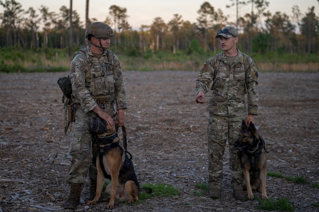 U.S. Air Force Airmen assigned to the 820th Base Defense Group discuss training objectives during a survival, evasion, resistance and escape (SERE) exercise.