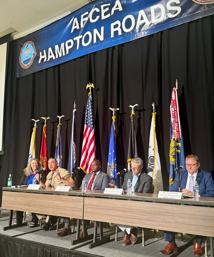 Capt. Chris Matassa, commanding officer of Naval Surface Warfare Center Carderock Division, discusses the implications of maritime warfare dominance with fellow Warfare Centers leaders during a panel session of the Department of the Navy Digital Warfighting Symposium East 2026 in Norfolk, Va., on May 12. Moderated by Dr. Julie Stark, director of the Navy’s Mid-Atlantic Tech Bridge, the panel deep dived into driving the future of information warfare, how industry and academia can help, and the resources required to accomplish information dominance. From left: Stark; Matassa; Nigel Thijs, technical director of NSWC Philadelphia; Stephen O’Grady, deputy technical director from Naval Undersea Warfare Center Newport; and David Smoak, chief engineer from Naval Information Warfare Center Atlantic.