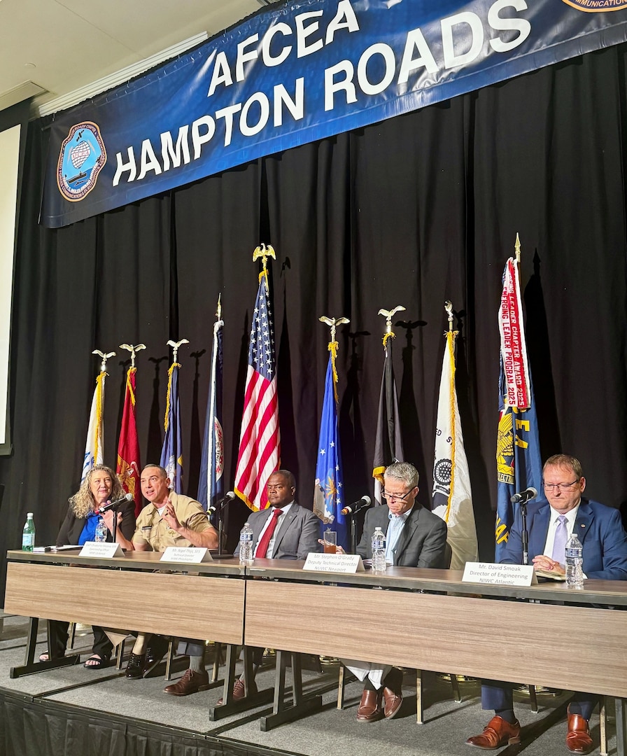 Capt. Chris Matassa, commanding officer of Naval Surface Warfare Center Carderock Division, discusses the implications of maritime warfare dominance with fellow Warfare Centers leaders during a panel session of the Department of the Navy Digital Warfighting Symposium East 2026 in Norfolk, Va., on May 12. Moderated by Dr. Julie Stark, director of the Navy’s Mid-Atlantic Tech Bridge, the panel deep dived into driving the future of information warfare, how industry and academia can help, and the resources required to accomplish information dominance. From left: Stark; Matassa; Nigel Thijs, technical director of NSWC Philadelphia; Stephen O’Grady, deputy technical director from Naval Undersea Warfare Center Newport; and David Smoak, chief engineer from Naval Information Warfare Center Atlantic.