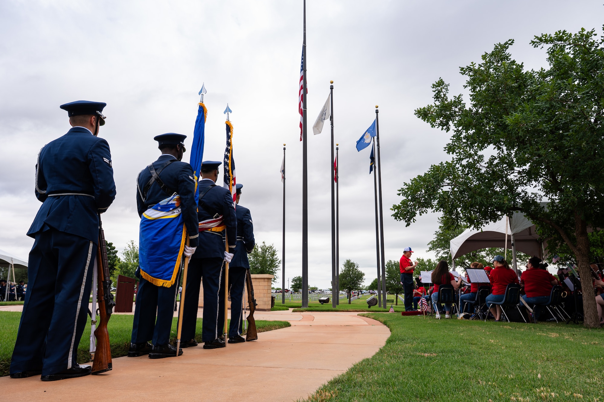 Members of the Dyess Air Force Base Honor Guard stand at ease prior to posting the colors during a Memorial Day ceremony at the Texas State Veterans Cemetery at Abilene, Texas, May 25, 2026. The annual event honored U.S. military service members who died in the line of duty. (U.S. Air Force photo by Senior Airman Jade M. Caldwell)