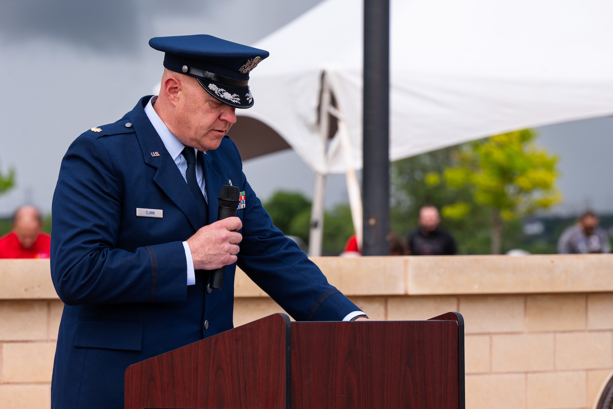 U.S. Air Force Maj. Robert Clark, 7th Bomb Wing chaplain, leads a prayer during a Memorial Day ceremony at the Texas State Veterans Cemetery at Abilene, Texas, May 25, 2026. Clark, traditionally assigned to the Rhode Island Air National Guard’s 143rd Airlift Wing, served on a Military Personnel Appropriation tour at Dyess, highlighting how Total Force Integration seamlessly blended active-duty and Guard personnel to support base operations and community engagements. (U.S. Air Force photo by Senior Airman Jade M. Caldwell)