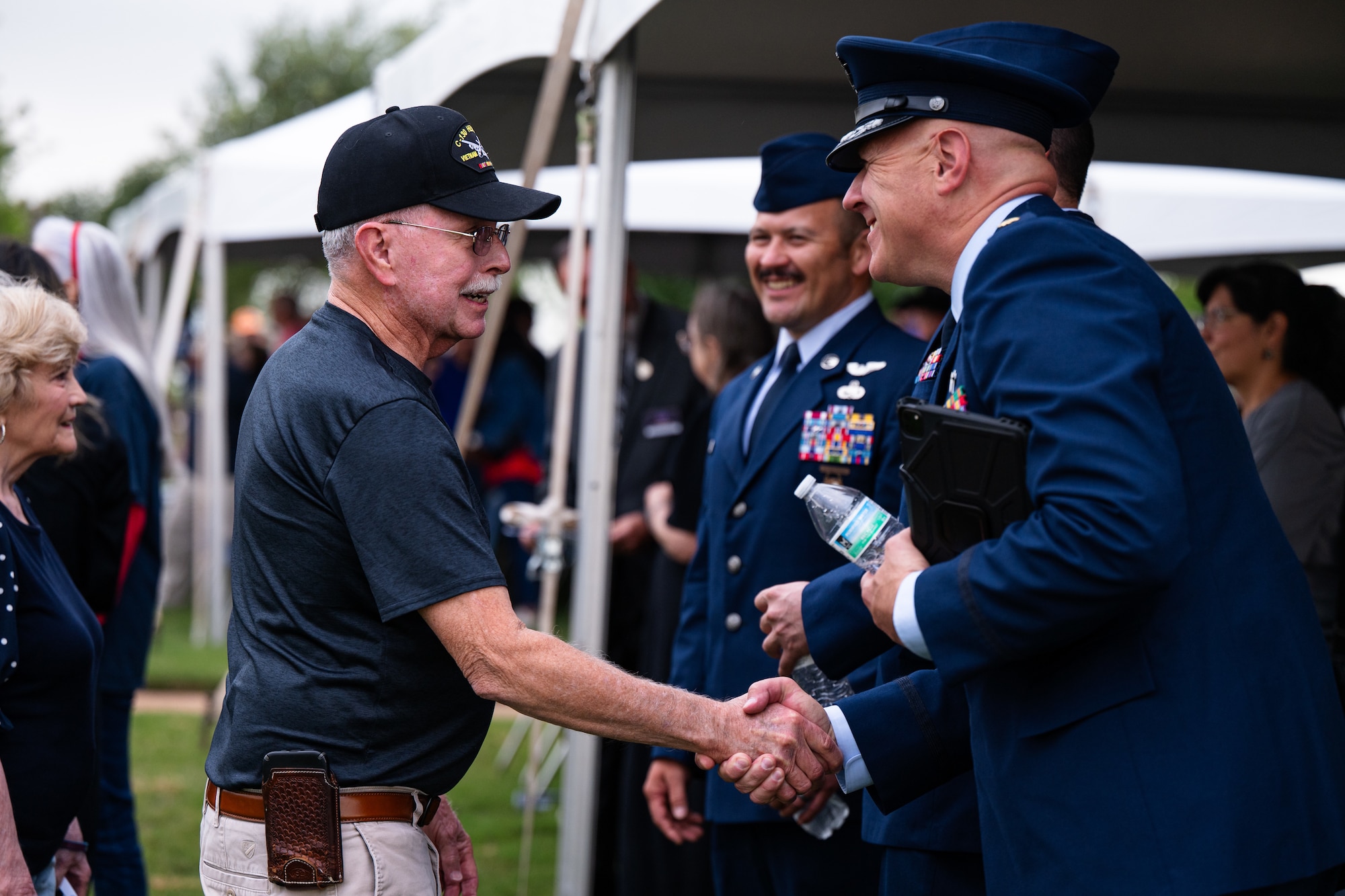U.S. Air Force Maj. Robert Clark, 7th Bomb Wing chaplain, greets event attendees following a Memorial Day ceremony at the Texas State Veterans Cemetery at Abilene, Texas, May 25, 2026. The Dyess Chiefs' Group partnered with the cemetery to host the annual observance, reinforcing the strong ties between the installation and the local community. (U.S. Air Force photo by Senior Airman Jade M. Caldwell)