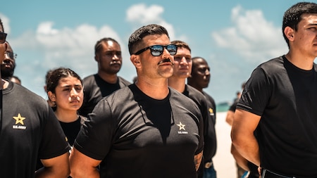 Future Soldiers participate in an enlistment ceremony during the Hyundai Air & Sea Show at Miami Beach, Florida, May 23, 2026. The ceremony recognized individuals committing to serve in the U.S. Army during the Memorial Day weekend event, which highlighted military service, readiness and community engagement.