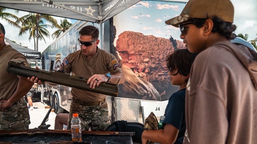 Soldiers interact with visitors during the Hyundai Air & Sea Show at Miami Beach, Florida, May 24, 2026. The Army showcased military vehicles, equipment and interactive displays during the Memorial Day weekend event to educate the public on Army capabilities, career opportunities and military service.