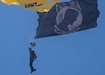 A member of the U.S. Army Golden Knights parachute team descends with a Prisoner of War/Missing in Action flag during the Hyundai Air and Sea Show in Miami Beach, Florida, May 24, 2026. The annual Memorial Day weekend event honored members of the U.S. Armed Forces through aerial demonstrations, parachute performances and military equipment displays. (U.S. Army photo by Spc. Jose Rolando Garcia)