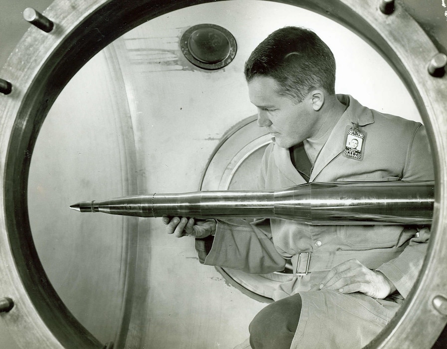 A model of the Minuteman intercontinental ballistic missile is adjusted prior to testing in a wind tunnel of the Gas Dynamics Facility of what was then known as Arnold Engineering Development Center in 1958. The decision to proceed with a Gas Dynamics Facility at AEDC was made by representatives of the Air Force, Navy, National Advisory Committee for Aeronautics, the government’s Research Development Board and aircraft industry during a meeting in Washington, D.C., in early 1950. On Oct. 30, 1959, the Gas Dynamics Facility was dedicated as the von Kármán Gas Dynamics Facility in honor of mathematician, physicist and engineer Theodore von Kármán. Arnold Engineering Development Center is now known as Arnold Engineering Development Complex, headquartered at Arnold Air Force Base, Tenn. (U.S. Air Force photo)