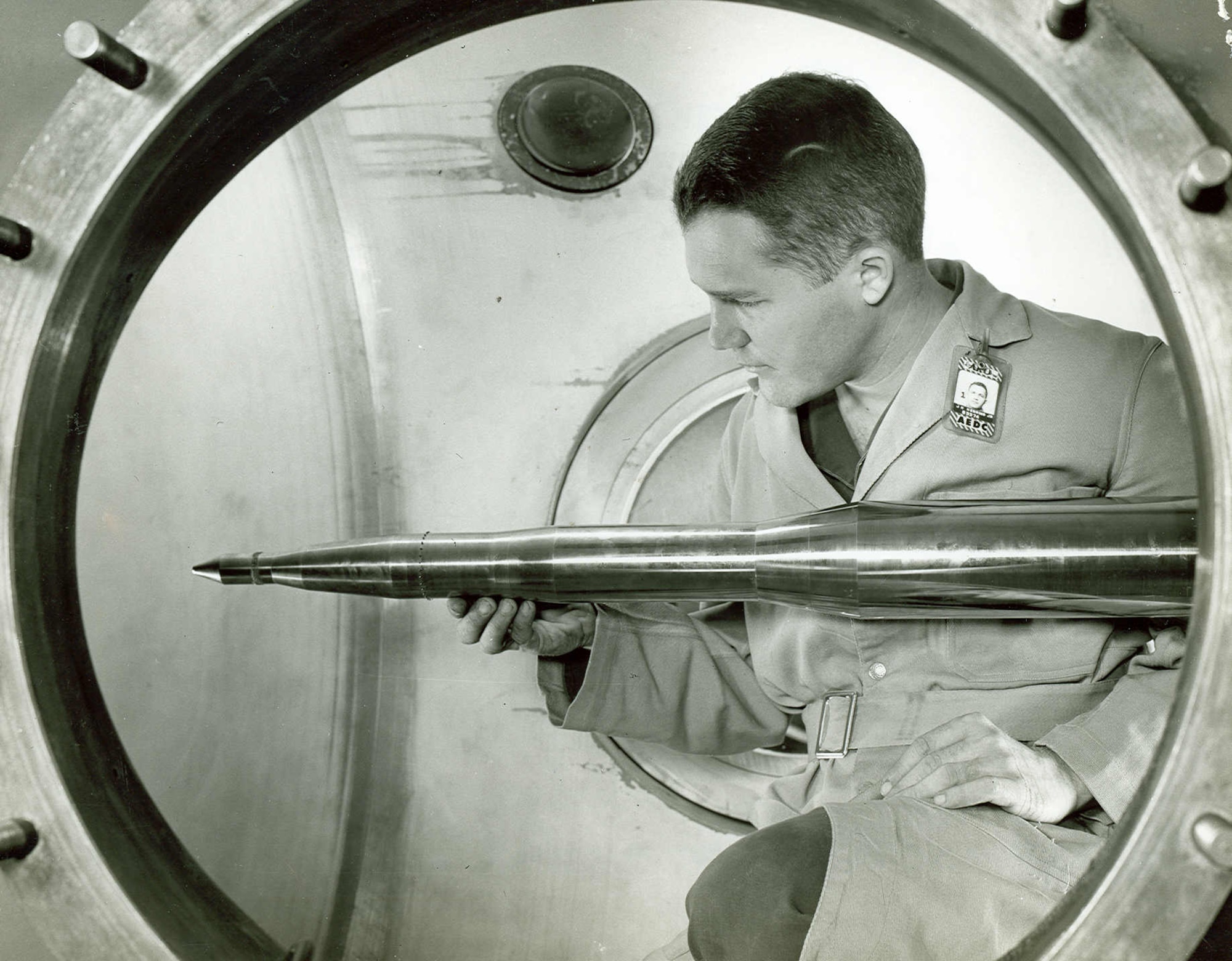 A model of the Minuteman intercontinental ballistic missile is adjusted prior to testing in a wind tunnel of the Gas Dynamics Facility of what was then known as Arnold Engineering Development Center in 1958. The decision to proceed with a Gas Dynamics Facility at AEDC was made by representatives of the Air Force, Navy, National Advisory Committee for Aeronautics, the government’s Research Development Board and aircraft industry during a meeting in Washington, D.C., in early 1950. On Oct. 30, 1959, the Gas Dynamics Facility was dedicated as the von Kármán Gas Dynamics Facility in honor of mathematician, physicist and engineer Theodore von Kármán. Arnold Engineering Development Center is now known as Arnold Engineering Development Complex, headquartered at Arnold Air Force Base, Tenn. (U.S. Air Force photo)