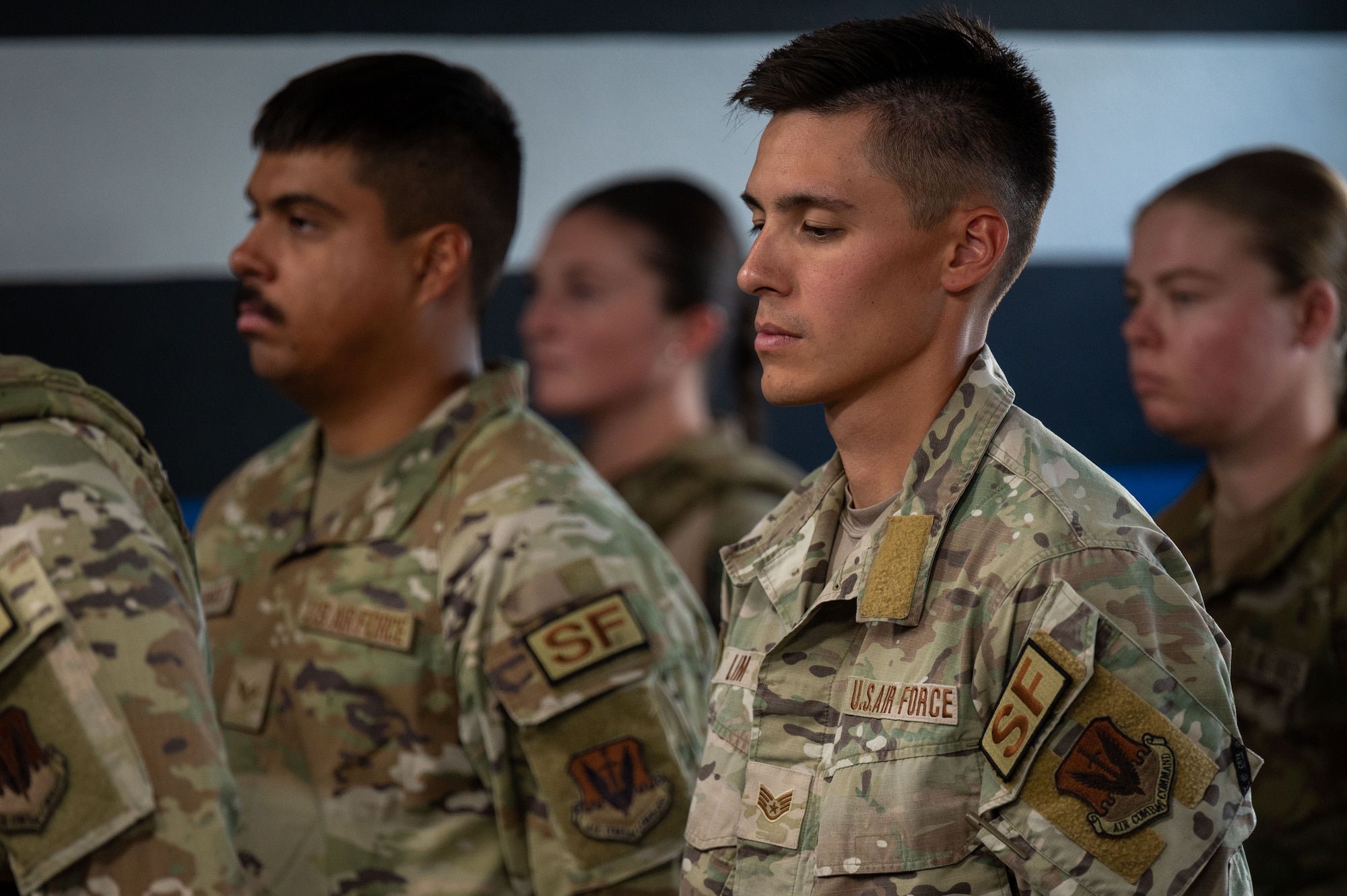 U.S. Air Force Airmen assigned to the 355th Security Forces Squadron stand at parade rest during the Final Guard Mount ceremony at Davis-Monthan Air Force Base, Arizona, May 21, 2026. The ceremony honored defenders who made the ultimate sacrifice. (U.S. Air Force photo by Airman 1st Class Jaden Kidd)