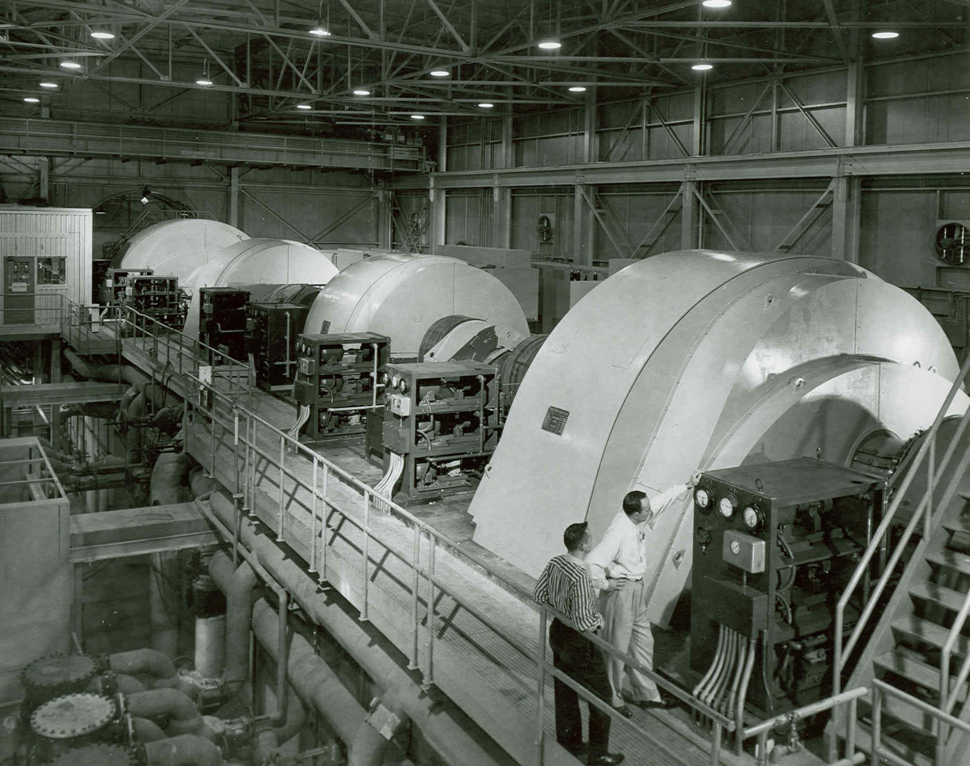 Motor drive compressors that generate airflow through the Propulsion Wind Tunnel of what was then known as the Arnold Engineering Development Center are shown in this photo from 1957. Planning for PWT began in January 1950 when representatives from the aircraft propulsion industry met with the Air Force Research and Development Board on Facilities. The funding program for the facility was issued the following year. Arnold Engineering Development Center is now known as Arnold Engineering Development Complex, headquartered at Arnold Air Force Base, Tenn. (U.S. Air Force photo)