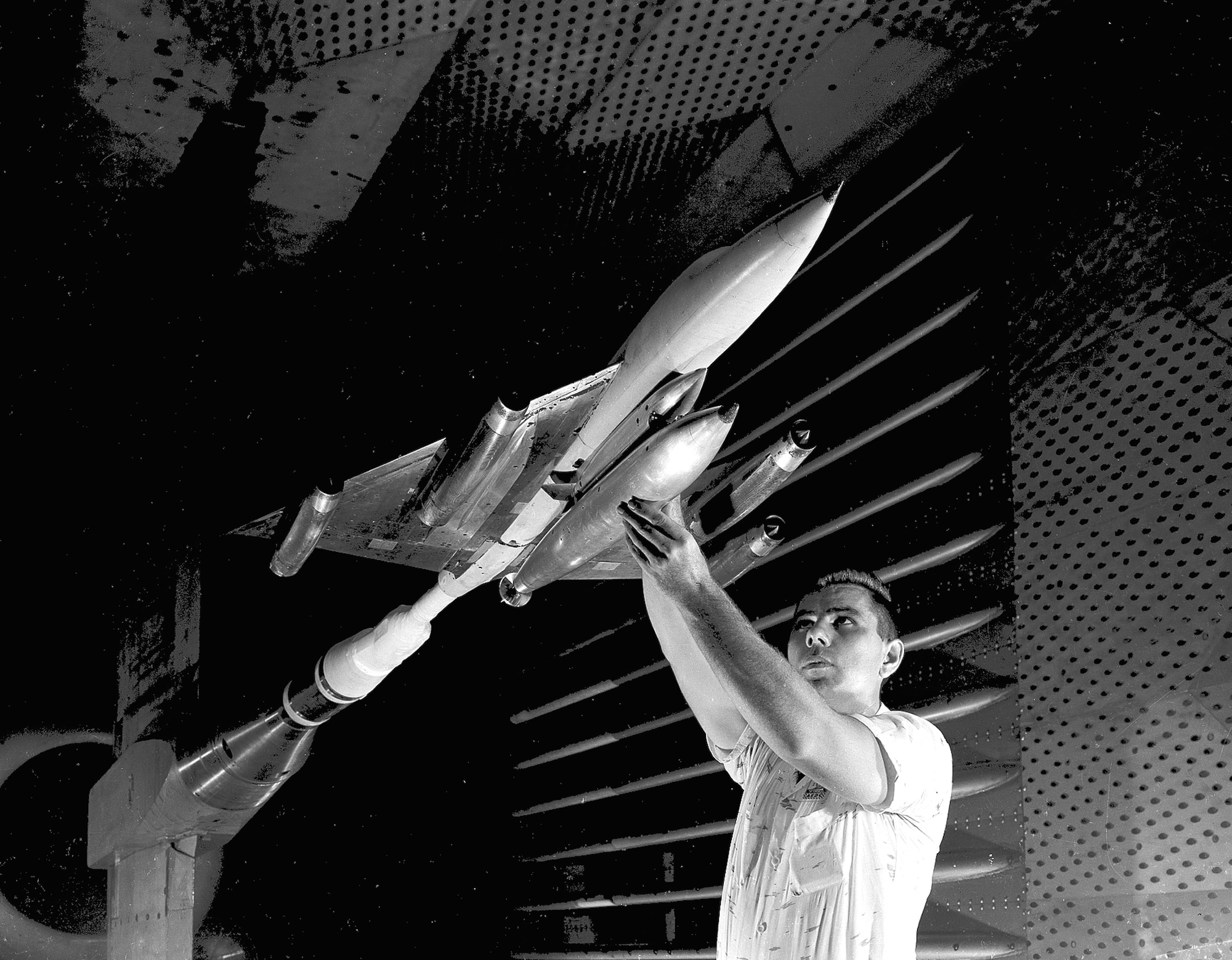 A model of the B-58 Hustler, the Air Force’s first operational supersonic bomber, is tested in the Propulsion Wind Tunnel 16-foot transonic wind tunnel of what was then known as Arnold Engineering Development Center in 1957. Planning for PWT began in January 1950 when representatives from the aircraft propulsion industry met with the Air Force Research and Development Board on Facilities. The funding program for the facility was issued the following year. Arnold Engineering Development Center is now known as Arnold Engineering Development Complex, headquartered at Arnold Air Force Base, Tenn. (U.S. Air Force photo)