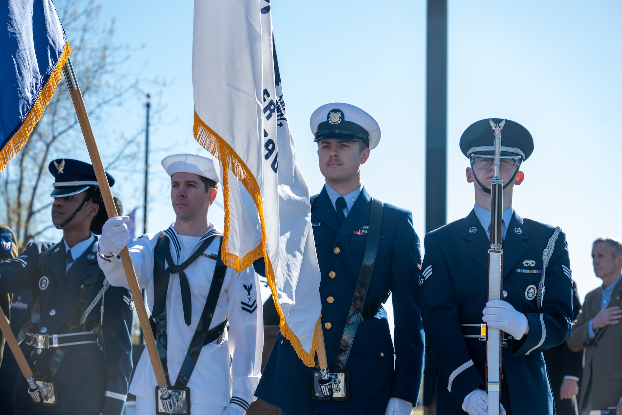 Members of a joint service honor guard present the colors during the playing of the national anthem at the Delaney Park Strip Veterans Memorial in Anchorage, Alaska, May 25, 2026. The presentation opened the official Municipality of Anchorage Memorial Day observance. (U.S. Air Force photo by Airman 1st Class Theodore Gowdy)