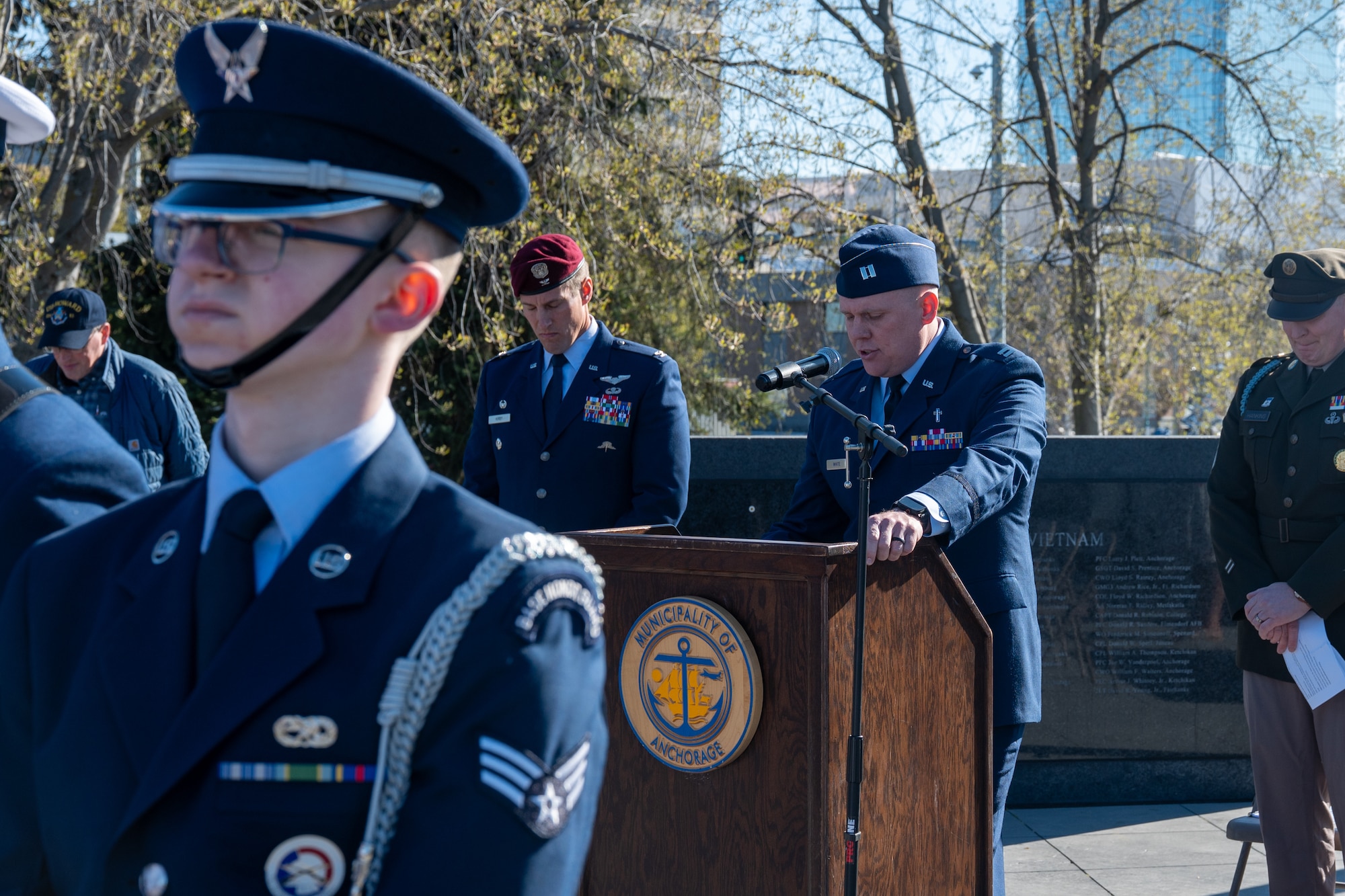 U.S. Air Force Chaplain (Capt.) Brandon White gives the invocation during the Anchorage Remembers Memorial Day Ceremony at the Delaney Park Strip Veterans Memorial in Anchorage, Alaska, May 25, 2026. The opening prayer set the tone for the community-wide day of remembrance. (U.S. Air Force photo by Airman 1st Class Theodore Gowdy)