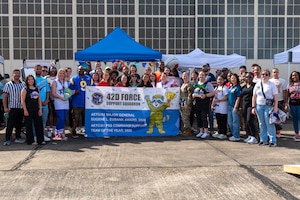 Members of the 42d Force Support Squadron hold a recognition banner at Maxwell Air Force Base, March 6, 2026. The unit was recognized as winning the Maj. Gen Eugene L. Eubank Award for 2025 for Air Education and Training Command