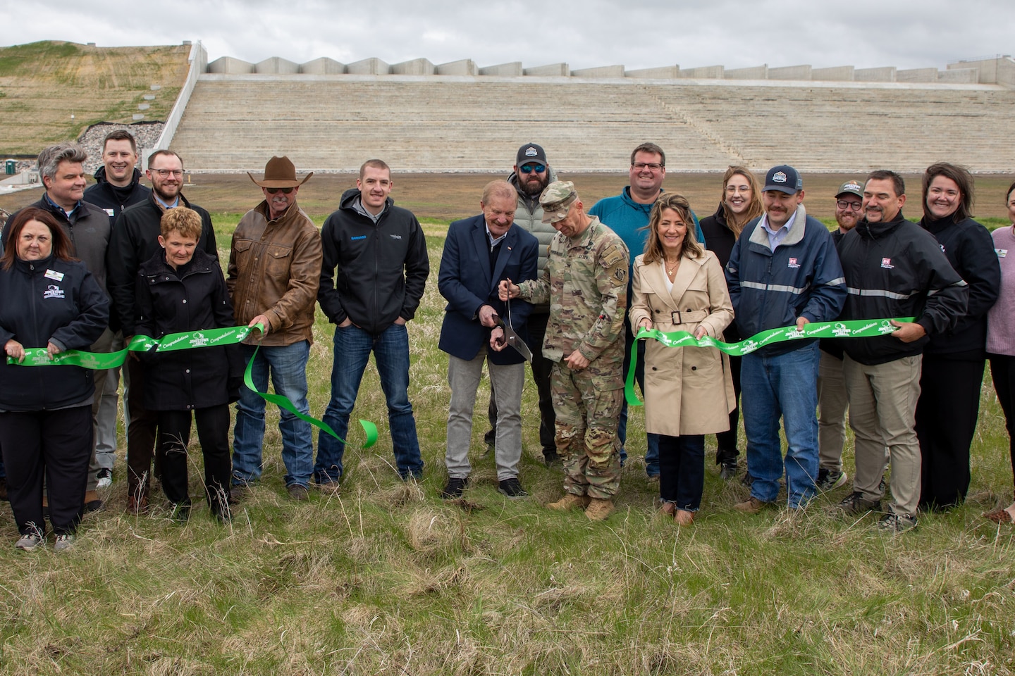 Leadership from the U.S. Army Corps of Engineers, Omaha District, alongside Jamestown Mayor Dwaine Heinrich, North Dakota Lt. Gov. Michelle Strinden, and contractor partners cut the ribbon for the Pipestem Dam spillway modification project in Jamestown, North Dakota, May 19, 2026. (U.S. Army photo by Delanie Stafford)