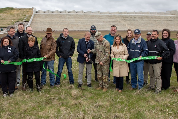 Leadership from the U.S. Army Corps of Engineers, Omaha District, alongside Jamestown Mayor Dwaine Heinrich, North Dakota Lt. Gov. Michelle Strinden, and contractor partners cut the ribbon for the Pipestem Dam spillway modification project in Jamestown, North Dakota, May 19, 2026. (U.S. Army photo by Delanie Stafford)